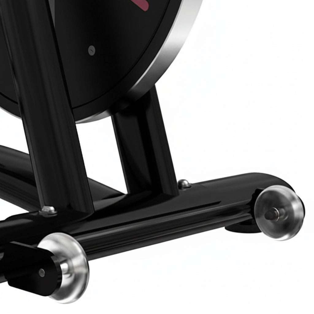 Close-up of the front base and transport wheels of a black indoor exercise bike
