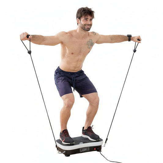 Man training on a vibration plate with resistance bands for full body home workout
