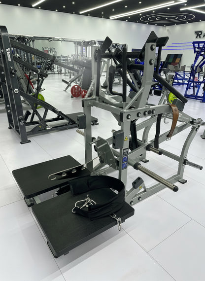 Belt squat and leg press combo machine set up on platforms in a modern gym