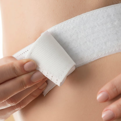 Close-up of Flexora belt elastic velcro strap being fastened
